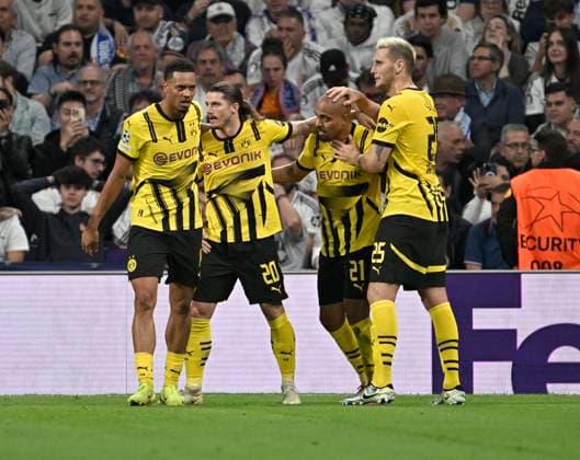 22 10 2024, Football UEFA Champions League 2024 2025, Matchday 3, Real Madrid Borussia Dortmund, at Estadio Santiango Bernabeu in Madrid Spain , Dortmunds goal celebration, scorer Donyell Malen Borussia Dortmund Marcel Sabitzer Borussia Dortmund and Niklas Süle Borussia Dortmund DFL and DFB regulations prohibit any use of photographs as image sequences and or quasi video