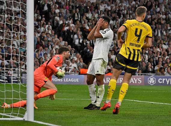 22 10 2024, Football UEFA Champions League 2024 2025, Matchday 3, Real Madrid Borussia Dortmund, at Estadio Santiango Bernabeu in Madrid Spain , Jude Bellingham Real Madrid slaps his hands in front of his face DFL and DFB regulations prohibit any use of photographs as image sequences and or quasi video
