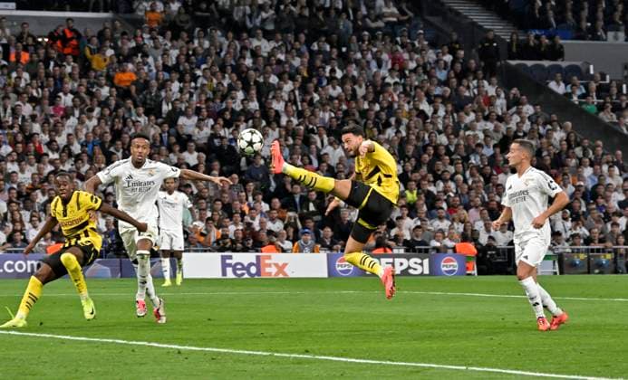 22 10 2024, Football UEFA Champions League 2024 2025, Matchday 3, Real Madrid Borussia Dortmund, at Estadio Santiango Bernabeu in Madrid Spain , Ramy Bensebaini Borussia Dortmund on the ball DFL and DFB regulations prohibit any use of photographs as image sequences and or quasi video