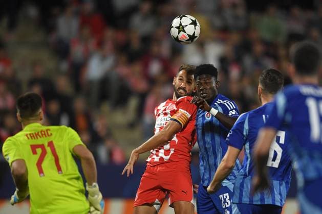 GIRONA FC vs SLOVAN BRATISLAVA Montilivi Municipal Stadium. Girona. Oct 22,2024 GIRONA FC-SLOVAN BRATISLAVA Oct 22,2024 Stuani (7) of Girona FC (left) vies with Sharani Zubero (23) of Slovan Bratislava during the UEFA Champions League 2024 25 League Phase match between Girona FC and Slovan Bratislava at Montilivi Municipal Stadium in Girona, Spain. Girona ESP Copyright: xS.xRosx