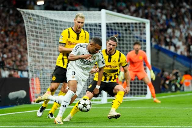 Real Madrid C.F. v Borussia Dortmund - UEFA Champions League 2024 25 League Phase MD3 Kylian Mbappe centre-forward of Real Madrid and France and Niklas Sule centre-back of Borussia Dortmund and Germany compete for the ball during the UEFA Champions League 2024 25 League Phase MD3 match between Real Madrid C.F. and Borussia Dortmund at Estadio Santiago Bernabeu on October 22, 2024 in Madrid, Spain. Madrid Spain  Copyright: xJosexBretonx originalFilename:bretonhernandez-realmadr241022_npSK4.jpg