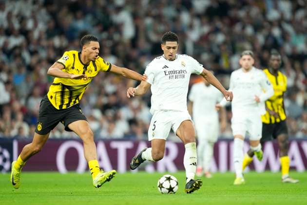 Real Madrid C.F. v Borussia Dortmund - UEFA Champions League 2024 25 League Phase MD3 Jude Bellingham central midfield of Real Madrid and England and Felix Nmecha central midfield of Borussia Dortmund and Germany compete for the ball during the UEFA Champions League 2024 25 League Phase MD3 match between Real Madrid C.F. and Borussia Dortmund at Estadio Santiago Bernabeu on October 22, 2024 in Madrid, Spain. Madrid Spain  Copyright: xJosexBretonx originalFilename:bretonhernandez-realmadr241022_npLqi.jpg