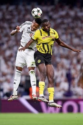Eder Militao of Real Madrid CF and Jamie Gittens of Borussia Dortmund Real Madrid v Borusssia Dortmund, La Liga, Football, Santiago Bernabeu Stadium, Madrid, Spain - 22 Oct 2024  Copyright: xRubenxAlbarran Shutterstockx 14805565aq