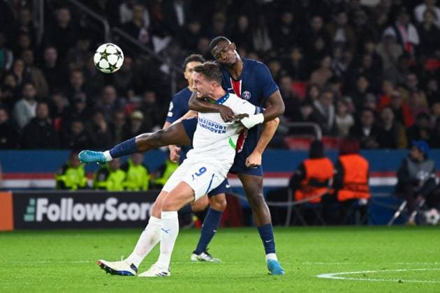 William Joel Tenorio Pacho ( 51 - PSG ) and Luuk De Jong ( 9 - PSV ) during the UEFA Champions League match between Paris Saint Germain and PSV Eindhoven at Parc Des Princes on October 22, 2024 in Paris, France. ( Photo by federico pestellini panoramic ) - FOOTBALL : PSG vs PSV - Ligue des Champions - 22 10 2024 FedericoPestellini Panoramic 