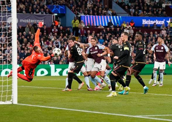 Birmingham, England, 22nd October 2024. Bologna s goalkeeper Lukasz Skorupski dives in vain as Villa score their first goal through a free kick by John McGinn during the UEFA Champions League match at Villa Park, Birmingham. Picture credit should read: Andrew Yates Sportimage EDITORIAL USE ONLY. No use with unauthorised audio, video, data, fixture lists, club league logos or live services. Online in-match use limited to 120 images, no video emulation. No use in betting, games or single club league player publications. SPI-3403-0034