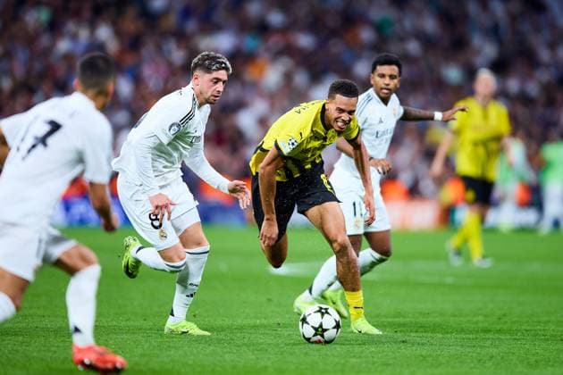 Felix Nmecha of Borussia Dortmund battles for the ball with Federico Valverde of Real Madrid CF during the UEFA Champions League match between Real Madrid vs Borussia Dortmund at Santiago Bernabeu on October 22, 2024 in Madrid (Photo by: LGM) FOOTBALL : Real Madrid vs Borussia Dortmund - UEFA Ligue des Champions - 22 10 2024 LGM Panoramic 