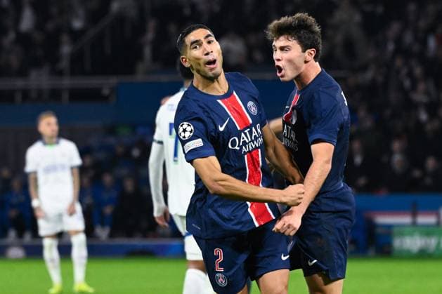 Achraf Hakimi ( 2 - PSG ) celebrates with Joao Pedro Goncalves Neves ( 87 - PSG ) during the UEFA Champions League match between Paris Saint Germain and PSV Eindhoven at Parc Des Princes on October 22, 2024 in Paris, France. ( Photo by federico pestellini panoramic ) - FOOTBALL : PSG vs PSV - Ligue des Champions - 22 10 2024 FedericoPestellini Panoramic 