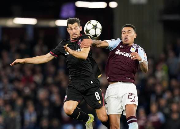 Birmingham, England, 22nd October 2024. Bologna s Remo Freuler and Aston Villa s Morgan Rogers tussle during the UEFA Champions League match at Villa Park, Birmingham. Picture credit should read: Andrew Yates Sportimage EDITORIAL USE ONLY. No use with unauthorised audio, video, data, fixture lists, club league logos or live services. Online in-match use limited to 120 images, no video emulation. No use in betting, games or single club league player publications. SPI-3403-0043