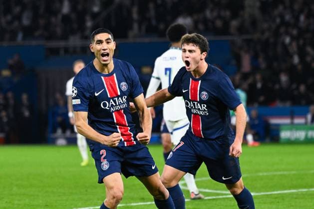 Sport Bilder des Tages Achraf Hakimi ( 2 - PSG ) celebrates with Joao Pedro Goncalves Neves ( 87 - PSG ) during the UEFA Champions League match between Paris Saint Germain and PSV Eindhoven at Parc Des Princes on October 22, 2024 in Paris, France. ( Photo by federico pestellini panoramic ) - FOOTBALL : PSG vs PSV - Ligue des Champions - 22 10 2024 FedericoPestellini Panoramic 
