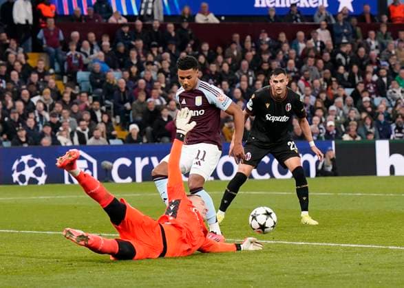Birmingham, England, 22nd October 2024. Bologna s goalkeeper Lukasz Skorupski makes a save in front of top Aston Villa?s Ollie Watkins during the UEFA Champions League match at Villa Park, Birmingham. Picture credit should read: Andrew Yates Sportimage EDITORIAL USE ONLY. No use with unauthorised audio, video, data, fixture lists, club league logos or live services. Online in-match use limited to 120 images, no video emulation. No use in betting, games or single club league player publications. SPI-3403-0051