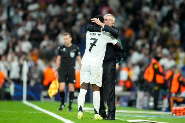 Real Madrid C.F. v Borussia Dortmund - UEFA Champions League 2024 25 League Phase MD3 Vinicius Junior left winger of Real Madrid and Brazil celebrates with Carlo Ancelotti head coach of Real Madrid after scoring his sides third goal during the UEFA Champions League 2024 25 League Phase MD3 match between Real Madrid C.F. and Borussia Dortmund at Estadio Santiago Bernabeu on October 22, 2024 in Madrid, Spain. Madrid Spain  Copyright: xJosexBretonx originalFilename:bretonhernandez-realmadr241022_npq3o.jpg