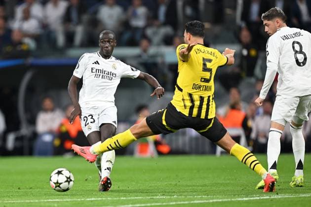 Madrid, Estadio Santiago Bernabeu, 22 10 24, GER, Men, UEFA Champions League, Season 2024 2025, Real Madrid Borussia Dortmund Picture from left Ferland MENDY Real Madrid , Rama BENSEBAINI Dortmund and FEDE VALVERDE Real Madrid Only for editorial use UEFA regulations prohibit any use of photographs as image sequences and or quasi video Spain