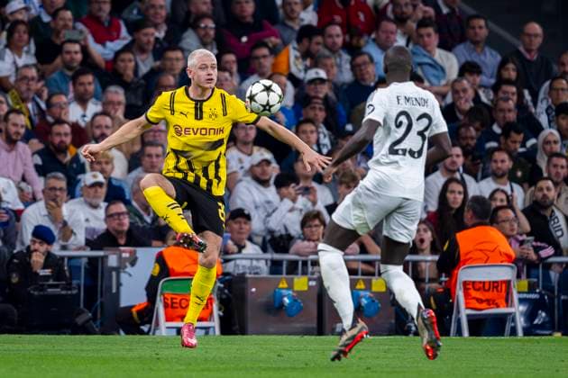 Real Madrid CF v Borussia Dortmund - UEFA Champions League 2024 25 League Phase MD3 Julian Ryerson of Borussia Dortmund (L) in action with the ball against Ferland Mendy of Real Madrid CF (R) during the UEFA Champions League 2024 25 League Phase MD3 match between Real Madrid CF and Borussia Dortmund at Estadio Santiago Bernabeu on October 22, 2024 in Madrid, Spain. Madrid Estadio Santiago Bernabeu Madrid Spain Copyright: xAlbertoxGardinx AGardin_20241022_Football_Champions_Real_Madrid_Borussia_Dortmund_43
