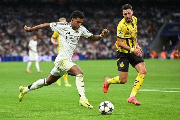Madrid, Estadio Santiago Bernabeu, 22 10 24, GER, Men, UEFA Champions League, Season 2024 2025, Real Madrid Borussia Dortmund Picture from left in duel RODRYGO Real Madrid and Ramy BENSEBAINI Dortmund Only for editorial use UEFA regulations prohibit any use of photographs as image sequences and or quasi video Spain