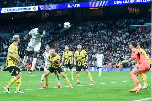 (241023) -- MADRID, Oct. 23, 2024 -- Antonio Rudiger (2nd L) of Real Madrid heads to score during the third round match of UEFA Champions League between Real Madrid and Borussia Dortmund in Santiago Bernabeu stadium, Madrid, Spain, Oct. 22, 2024. (Photo by Xinhua) (SP)SPAIN-MADRID-FOOTBALL-UEFA CHAMPIONS LEAGUE-REAL MADRID VS DORTMUND GustavoxValiente 