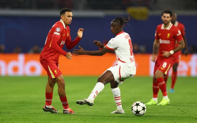 Trent Alexander-Arnold of Liverpool and Amadou Haidara of RB Leipzig in action RB Leipzig v Liverpool, UEFA Champions League, Group Stage, Football, Red Bull Arena, Leipzig, Germany, 23 Oct 2024 EDITORIAL USE ONLY No use with unauthorised audio, video, data, fixture lists, club league logos or live services. Online in-match use limited to 120 images, no video emulation. No use in betting, games or single club league player publications.  Copyright: xKieranxMcManus Shutterstockx 14801646n