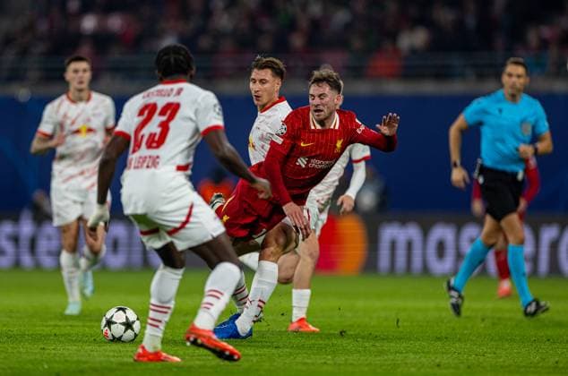 Football - UEFA Champions League - League Phase - RB Leipzig v Liverpool FC LEIPZIG, GERMANY - Wednesday, October 23, 2024: Liverpool s Alexis Mac Allister is fouled but the referee gave a yellow card to the Liverpool player for simulation during the UEFA Champions League Match Day 3 game between RB Leipzig and Liverpool FC at the Red Bull Arena. (Photo by David Rawcliffe Propaganda) LEIPZIG Red Bull Arena SAXONY GERMANY  Copyright: xDavidxRawcliffex P2024-10-23-Leipzig_Liverpool-9