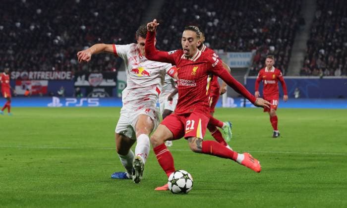 Willi Orban, Konstantinos Tsimikas duel Match scene Action Sport Football Soccer UEFA Champions League UCL Men 3 Matchday Season 2024 2025 23 10 2024 Rasen Ballsport RB Leipzig RBL vs Liverpool FC LFC DFL regulations prohibit any use of photographs as image sequences and or quasi video