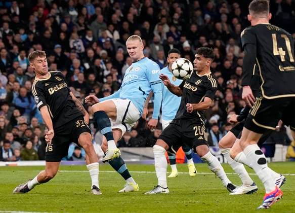 Manchester, England, 23rd October 2024. Erling Haaland of Manchester City with Qazim Laci of Sparta Prague during the UEFA Champions League match at the Etihad Stadium, Manchester. Picture credit should read: Andrew Yates Sportimage EDITORIAL USE ONLY. No use with unauthorised audio, video, data, fixture lists, club league logos or live services. Online in-match use limited to 120 images, no video emulation. No use in betting, games or single club league player publications. SPI-3405-0025