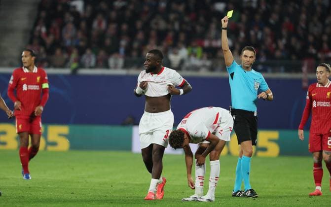 Referee Sandro Schärer SUI yellow card for Lutsharel Geertruida Sport Football Soccer UEFA Champions League UCL Men 3 Matchday Season 2024 2025 23 10 2024 Rasen Ballsport RB Leipzig RBL vs Liverpool FC LFC DFL regulations prohibit any use of photographs as image sequences and or quasi video