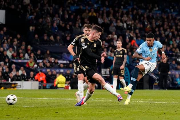 Manchester, England, 23rd October 2024. Savinho of Manchester City has a shot during the UEFA Champions League match at the Etihad Stadium, Manchester. Picture credit should read: Andrew Yates Sportimage EDITORIAL USE ONLY. No use with unauthorised audio, video, data, fixture lists, club league logos or live services. Online in-match use limited to 120 images, no video emulation. No use in betting, games or single club league player publications. SPI-3405-0029