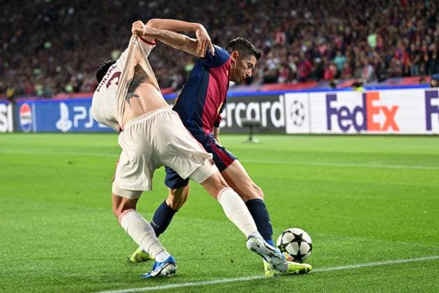 Barcelona, Estadi Olimpic Lluis Companys, 23 10 24, GER, Men, UEFA Champions League, Season 2024 2025, FC Barcelona FC Bayern Muenchen Picture from left in duel Min Jae KIM Muenchen and Robert LEWANDOWSKI Barcelona Only for editorial use UEFA regulations prohibit any use of photographs as image sequences and or quasi video Catalonia Spain