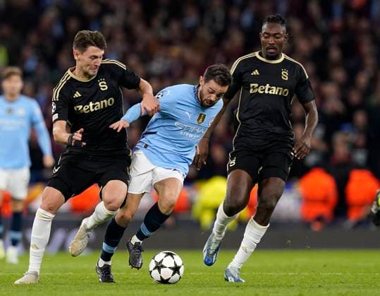 Manchester, England, 23rd October 2024. Bernardo Silva of Manchester City with Kaan Kairinen of Sparta Prague during the UEFA Champions League match at the Etihad Stadium, Manchester. Picture credit should read: Andrew Yates Sportimage EDITORIAL USE ONLY. No use with unauthorised audio, video, data, fixture lists, club league logos or live services. Online in-match use limited to 120 images, no video emulation. No use in betting, games or single club league player publications. SPI-3405-0034