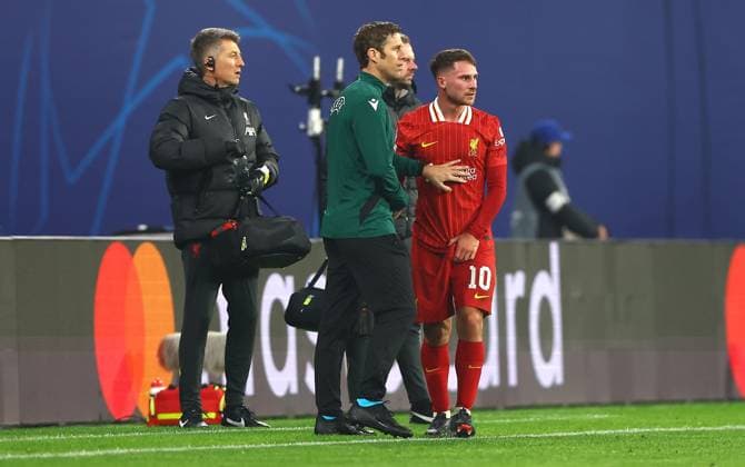 Alexis Mac Allister of Liverpool feels the pain from an injury RB Leipzig v Liverpool, UEFA Champions League, Group Stage, Football, Red Bull Arena, Leipzig, Germany, 23 Oct 2024 EDITORIAL USE ONLY No use with unauthorised audio, video, data, fixture lists, club league logos or live services. Online in-match use limited to 120 images, no video emulation. No use in betting, games or single club league player publications.  Copyright: xKieranxMcManus Shutterstockx 14801646aj