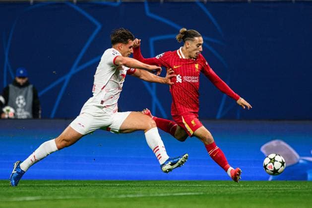 LEIPZIG, GERMANY - 23 OCTOBER, 2024: Willi Orban, Kostas Tsimikas, The match of UEFA Champions League RB Leipzig vs FC Liverpool at Red Bull Arena  Copyright: xVITALIIxVITLEOx