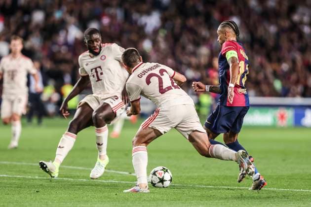 October 23, 2024, Barcelona, Barcelona, SPAIN: Raphinha Dias Belloli of FC Barcelona, Barca and Raphael Guerreiro of Bayern Munchen in action during the UEFA Champions League 2024 25 League Phase MD3 match between FC Barcelona and FC Bayern Munchen at Estadi Olimpic Lluis Companys on October 23, 2024 in Barcelona, Spain. Barcelona SPAIN - ZUMAa181 20241023_zaa_a181_117 Copyright: xJavierxBorregox
