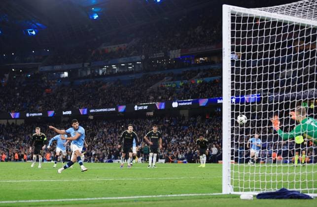 Matheus Nunes of Manchester City scores a goal from the penalty spot to make it 5-0 Manchester City v Sparta Praha, UEFA Champions League, Group Stage, Football, Etihad Stadium, Manchester, UK, 23 Oct 2024 EDITORIAL USE ONLY No use with unauthorised audio, video, data, fixture lists, club league logos or live services. Online in-match use limited to 120 images, no video emulation. No use in betting, games or single club league player publications. Copyright: xMattxWest Shutterstockx 14801642ay