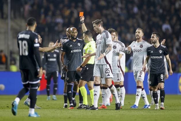 BAKOE, 24-10-2024, Tofiq Bahramov Stadium , season 2024 2025 , Europa League match between FK Qarabag and Ajax . Referee Nicholas Walsh shows red card to Qarabag player Julio Romao Qarabag - Ajax  x26552877x Copyright: