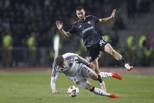 BAKOE, 24-10-2024, Tofiq Bahramov Stadium , season 2024 2025 , Europa League match between FK Qarabag and Ajax. Qarabag player Abbas Huseynov and Ajax player Mika Godts Qarabag - Ajax  x26552907x Copyright: