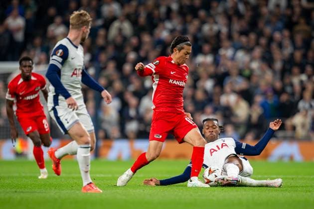 Tottenham Hotspur v AZ Alkmaar Europa League 24 10 2024. Tottenham Hotspur defender Destiny Udogie (13) tackles AZ Alkmaar defender Seiya Maikuma (16) during the Europa League match between Tottenham Hotspur and AZ Alkmaar at Tottenham Hotspur Stadium, London, United Kingdom on 24 October 2024. Editorial use only , Copyright: xIanxStephenx PSI-20649-0007