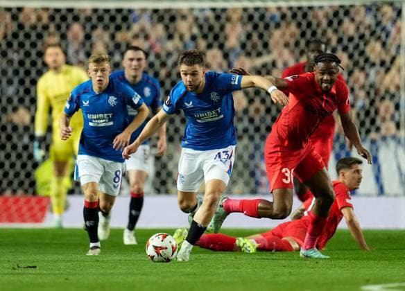 Nicolas Raskin of Rangers beats Siyabonga Ngezana of FCSB. Rangers v FCSB, UEFA Europa League, Group Stage, Football, Ibrox Stadium, Glasgow, Scotland, UK, 24 Oct 2024 EDITORIAL USE ONLY No use with unauthorised audio, video, data, fixture lists, club league logos or live services. Online in-match use limited to 120 images, no video emulation. No use in betting, games or single club league player publications. Copyright: xStuartxWallace Shutterstockx 14801669cj