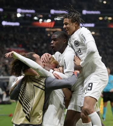Goalscorer Hugo Larsson left cheers with Jean Matteo Bahoya right and Niels Nkounkou mi photographed during the soccer Europa League match Eintracht Frankfurt vs Rigas AS on 24 10 2024 in Frankfurt DFL DFB REGULATIONS PROHIBIT ANY USE OF PHOTOGRAPHS as IMAGE SEQUENCES and or QUASI VIDEO