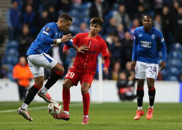 Football - 2024 2025 UEFA Europa League - League Phase - Matchday Three of Eight - Glasgow Rangers vs FCSB - Ibrox Stadium - Thursday 23rd October 2024 James Tavernier of Rangers vies with Alexandra Musi of FCSB 