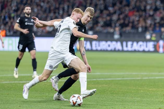 Eintracht Frankfurt FC Rigas FS, UEFA Europa League Hugo Larsson Eintracht Frankfurt, 16 gets the better of the charging Ziga Lipuscek Riga, 43 to score the goal of the day during the 1-0 match of the league phase of the UEFA Europa League between Eintracht Frankfurt and FC Rigas FS at Deutsche Bank Park in Frankfurt am Main , Frankfurt am Main Hessen Germany Deutsche Bank Park on October 24, 2024