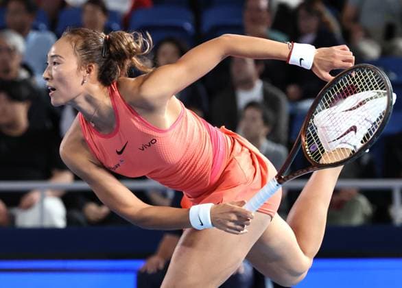 October 25, 2024, Tokyo , Japan - Zheng Qinwen of China delivers a service against Leylah Fernandez of Canada at the quarter final match of the Toray Pan Pacific Open tennis tournament at the Ariake Colosseum in Tokyo on Friday, October 25, 2024. The first seeded Zheng defeated Fernandez. (photo by Yoshio Tsunoda AFLO) Noxthirdxpartyxsales  (0775274573st)