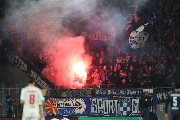 Fans of SC Paderborn using pyrotechnics during the 2 Bundesliga match between 1 FC Köln and SC Paderborn 07, RheinEnergieStadion on October 25, 2024 in Cologne, Germany Photo by Oliver Kaelke DeFodi Images Supporters of SC Paderborn use pyrotechnics during the 2 Bundesliga match between 1 FC Koeln and SC Paderborn 07 at RheinEnergieStadion on October 25, 2024 in Cologne, Germany Photo by Oliver Kaelke DeFodi Images DFL regulations prohibit any use of photographs as image sequences and or quasi video not used in POL SRB CRO FRA GBR NED ITA USA Defodi 678 2024 10 25 OK FCKSCP 0923 Defodi-678 not used in POL SRB CRO FRA GBR NED ITA USA DFL regulations prohibit any use of photographs as image sequences and or quasi-video.