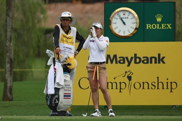 KUALA LUMPUR, - OCTOBER 26: Atthaya Jeeno Thitikul of Thailand with her caddie Banpot Bunpisansaree during the third round of the 2024 LPGA, Golf Damen Maybank Championship held at Kuala Lumpur Golf and Country Club in Kuala Lumpur, Malaysia on October 26, 2024.(Photo by Hazrin Yeob Men Shah Icon Sportswire) GOLF: OCT 26 LPGA Maybank Championship EDITORIAL USE ONLY Icon3782410262680