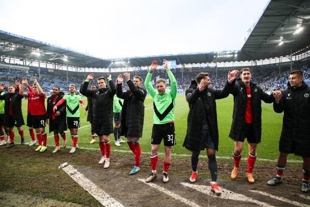 The Hannover 96 team cheers after the match in front of the fan block 2 Soccer Bundesliga season 2024 2025 1 FC Magdeburg vs Hannover 96 at the Avnet Arena in Magdeburg Action,Soccer,Man,Men,Germany,27 10 2024