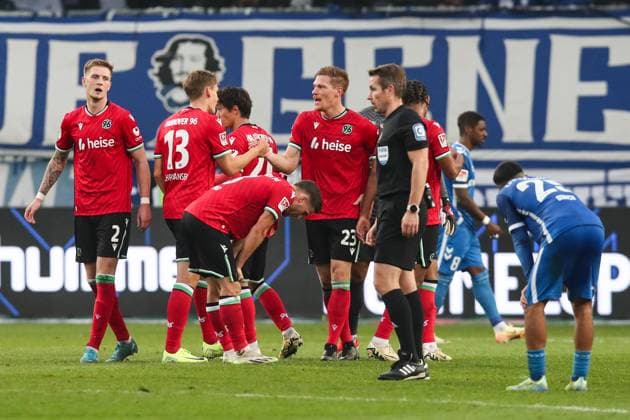 Marcel Halstenberg M ,Hannover 96,23 with Max Christiansen Hannover 96,13 and Josh Knight Hannover 96,2 2 Soccer Bundesliga Season 2024 2025 1 FC Magdeburg vs Hannover 96 at the Avnet Arena in Magdeburg Action,Soccer,Man,Men,Germany,27 10 2024