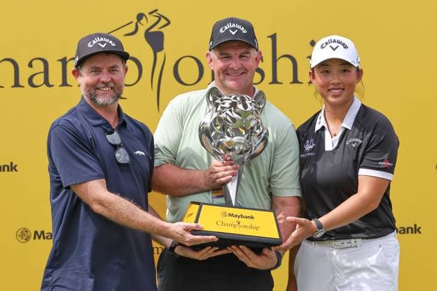 KUALA LUMPUR, - OCTOBER 27: Ruoning Yin of China poses with the trophy after winning the tournament with Adam Olarenshaw and David Jones following the final round of the Maybank Championship 2024 at Kuala Lumpur Golf & Country Club on October 27, 2024 in Kuala Lumpur, Malaysia.(Photo by Hazrin Yeob Men Shah Icon Sportswire) GOLF: OCT 27 LPGA, Golf Damen Maybank Championship EDITORIAL USE ONLY Icon3782410275221