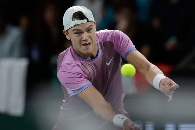 Paris, 29 10 2024 Tennis Rolex Paris Masters 2024, Matteo Arnaldi ITA Holger Rune v l , Holger Rune DK plays a backhand Copyright: AntonioxBorga