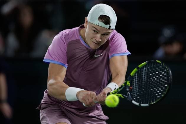 Paris, 29 10 2024 Tennis Rolex Paris Masters 2024, Matteo Arnaldi ITA Holger Rune v l , Holger Rune DK plays a backhand Copyright: AntonioxBorga