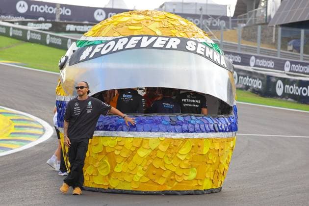 FORMULA 1 LENOVO GRANDE PREMIO DE SAO PAULO 2024 31 10 2024, Autodromo Jose Carlos Pace, Interlagos, FORMULA 1 LENOVO GRANDE PREMIO DE SAO PAULO 2024 , pictured Lewis Hamilton GBR , Mercedes AMG Petronas Formula One Team stands by a replica of the Senna Helmet, created by a local artist in collaboration with Sebastian Vettel and the Senna Foundation and at the Sao Paulo Grand Prix nordphotoxGmbHx xBratic nph00250