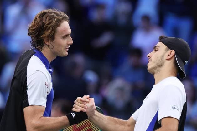 (241101) -- PARIS, Nov. 1, 2024 -- Stefanos Tsitsipas (L) of Greece greets Francisco Cerundolo of Argentina after the singles round of 16 match between Stefanos Tsitsipas of Greece and Francisco Cerundolo of Argentina at Paris ATP, Tennis Herren Masters 1000 tennis tournament in Paris, France, Oct. 31, 2024. ) (SP)FANCE-PARIS-TENNIS-ATP-MASTERS GaoxJing 