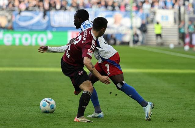 GER, 2 Liga, Hamburger SV vs 1 FC Nuernberg 03 11 2024, Volksparkstadion, Hamburg, GER, 2 Liga, Hamburger SV vs 1 FC Nuernberg im Bild picture shows Jean Luc DompÃ Dompe Hamburger SV 07 in duel against Oliver Villadsen 1 FC Nuernberg 02 nordphotoxGmbHx xTauchnitz nph00059