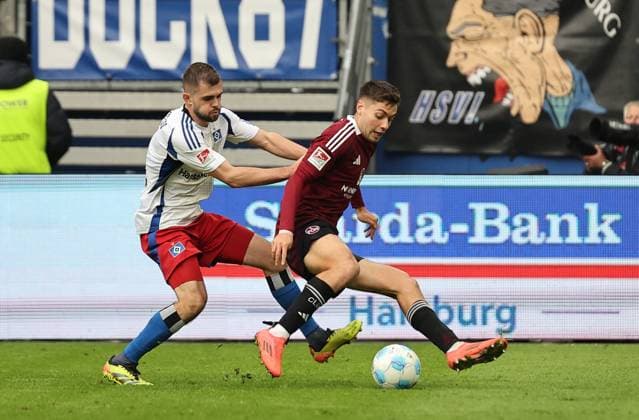 GER, 2 Liga, Hamburger SV vs 1 FC Nuernberg 03 11 2024, Volksparkstadion, Hamburg, GER, 2 Liga, Hamburger SV vs 1 FC Nuernberg im Bild picture shows Lukasz Poreba Hamburger SV 06 in duel against Stefanos Tzimas 1 FC Nuernberg 09 nordphotoxGmbHx xTauchnitz nph00059